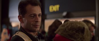 Movie still from “Die Hard” (1988), directed by John McTiernan – A person wearing a jacket; Close Up shot, Low angle