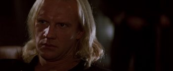 Movie still from “Die Hard” (1988), directed by John McTiernan – A person with blonde hair; Close Up shot, Low angle