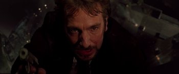 Movie still from “Die Hard” (1988), directed by John McTiernan – A person with a bloody nose; Close Up shot, Low angle