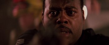 Movie still from “Die Hard” (1988), directed by John McTiernan – A man's eyes and face; Extreme Close Up shot, Low angle