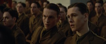 Movie still from “The King's Man” (2021), directed by Matthew Vaughn – A group of men in uniform standing next to each other; Close Up shot, Over the shoulder angle