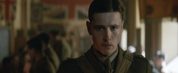 Movie still from “The King's Man” (2021), directed by Matthew Vaughn – A person wearing a military uniform; Close Up shot, Low angle