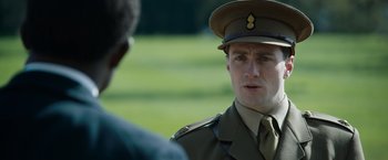 Movie still from “The King's Man” (2021), directed by Matthew Vaughn – A man in a uniform talking to another man; Close Up shot, Over the shoulder angle