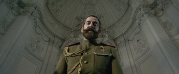 Movie still from “The King's Man” (2021), directed by Matthew Vaughn – A man in a military uniform with a beard; Close Up shot, Low angle