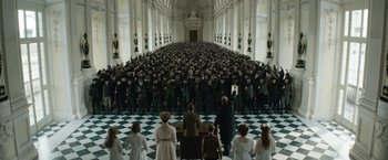 Movie still from “The King's Man” (2021), directed by Matthew Vaughn – A group of people standing in front of a large group; Wide shot, High angle