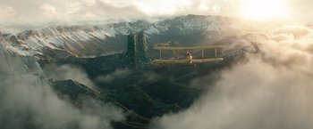 Movie still from “The King's Man” (2021), directed by Matthew Vaughn – An airplane is flying over a mountain range; Extreme Wide shot, Low angle