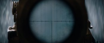 Movie still from “The King's Man” (2021), directed by Matthew Vaughn – A rifle scope looking at a target; Extreme Close Up shot, Overhead angle