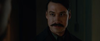 Movie still from “The King's Man” (2021), directed by Matthew Vaughn – A person with a mustache; Close Up shot, Low angle