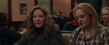 Movie still from “The Kitchen” (2019), directed by Andrea Berloff – Two women sitting in a booth at a restaurant; Close Up shot, Over the shoulder angle