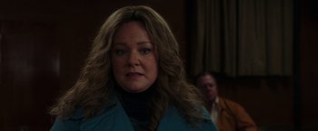 Movie still from “The Kitchen” (2019), directed by Andrea Berloff – A person with long hair; Close Up shot, Over the shoulder angle