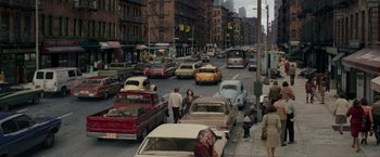 Movie still from “The Kitchen” (2019), directed by Andrea Berloff – A city street filled with lots of traffic; Extreme Wide shot, High angle