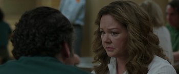 Movie still from “The Kitchen” (2019), directed by Andrea Berloff – A woman with long brown hair is looking at a man with long brown hair; Close Up shot, Over the shoulder angle