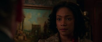 Movie still from “The Kitchen” (2019), directed by Andrea Berloff – A person with a painting in the background; Close Up shot, Over the shoulder angle