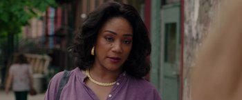 Movie still from “The Kitchen” (2019), directed by Andrea Berloff – A person wearing a purple shirt; Close Up shot, Over the shoulder angle