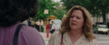 Movie still from “The Kitchen” (2019), directed by Andrea Berloff – A person on a city street; Close Up shot, Over the shoulder angle