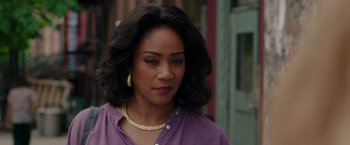 Movie still from “The Kitchen” (2019), directed by Andrea Berloff – A person wearing a purple shirt; Close Up shot, Over the shoulder angle