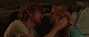 Movie still from “The Kitchen” (2019), directed by Andrea Berloff – A man and a woman in a bed touching heads; Close Up shot, Overhead angle