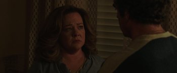 Movie still from “The Kitchen” (2019), directed by Andrea Berloff – A person talking to another person; Close Up shot, Over the shoulder angle