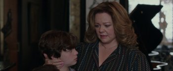 Movie still from “The Kitchen” (2019), directed by Andrea Berloff – A woman and a boy looking at each other; Close Up shot, Over the shoulder angle