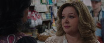 Movie still from “The Kitchen” (2019), directed by Andrea Berloff – A person in a store; Close Up shot, Over the shoulder angle