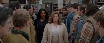 Movie still from “The Kitchen” (2019), directed by Andrea Berloff – A group of people standing in a room; Medium shot, Over the shoulder angle