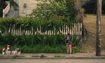 A man standing on the side of the street