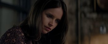 Movie still from “The Last Letter from Your Lover” (2021), directed by Augustine Frizzell – A person with long brown hair; Close Up shot, Over the shoulder angle