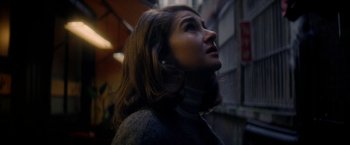 Movie still from “The Last Letter from Your Lover” (2021), directed by Augustine Frizzell – A young woman is looking up at the sky; Close Up shot, Low angle