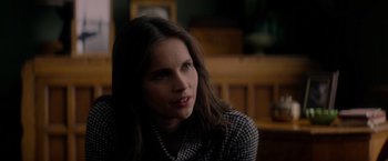 Movie still from “The Last Letter from Your Lover” (2021), directed by Augustine Frizzell – A person sitting in front of a window; Close Up shot, Over the shoulder angle