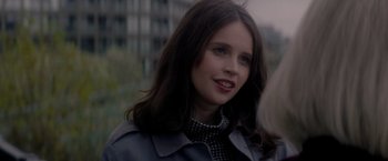 Movie still from “The Last Letter from Your Lover” (2021), directed by Augustine Frizzell – A person wearing a jacket; Close Up shot, Over the shoulder angle