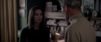 Movie still from “The Last Letter from Your Lover” (2021), directed by Augustine Frizzell – A man and a woman are talking in a room; Close Up shot, Over the shoulder angle