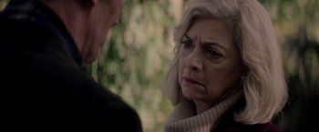 Movie still from “The Last Letter from Your Lover” (2021), directed by Augustine Frizzell – An older woman and a younger man are looking at one another; Close Up shot, Over the shoulder angle