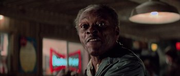 Movie still from “The Last Starfighter” (1984), directed by Nick Castle – An older man with a surprised look on his face; Close Up shot, Low angle