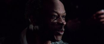 Movie still from “The Last Starfighter” (1984), directed by Nick Castle – A person looking at the camera; Close Up shot, Low angle