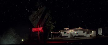Movie still from “The Last Starfighter” (1984), directed by Nick Castle – A night scene of a motel and a restaurant; Extreme Wide shot, Low angle