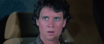 Movie still from “The Last Starfighter” (1984), directed by Nick Castle – A person with blue eyes; Close Up shot, Over the shoulder angle