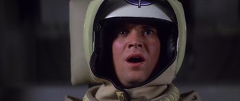 Movie still from “The Last Starfighter” (1984), directed by Nick Castle – A person wearing a helmet; Close Up shot, Low angle