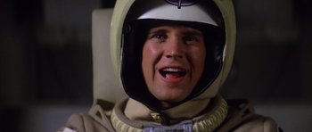 Movie still from “The Last Starfighter” (1984), directed by Nick Castle – A person wearing a helmet; Close Up shot, Low angle
