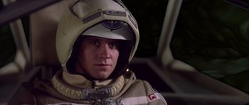 Movie still from “The Last Starfighter” (1984), directed by Nick Castle – A man in a space suit is wearing a helmet; Close Up shot, Low angle