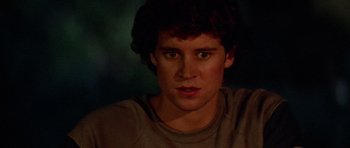 Movie still from “The Last Starfighter” (1984), directed by Nick Castle – A young man is looking into the camera; Close Up shot, Over the shoulder angle