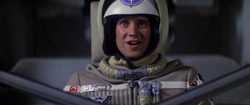 Movie still from “The Last Starfighter” (1984), directed by Nick Castle – A man in a space suit with a helmet on; Close Up shot, Low angle