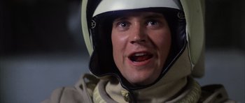 Movie still from “The Last Starfighter” (1984), directed by Nick Castle – A person wearing a helmet; Close Up shot, Low angle