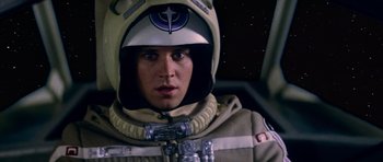 Movie still from “The Last Starfighter” (1984), directed by Nick Castle – A man in a space suit with a helmet on his head; Close Up shot, Overhead angle
