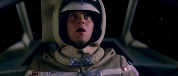 Movie still from “The Last Starfighter” (1984), directed by Nick Castle – A man in a space suit and a helmet looking up; Close Up shot, Low angle