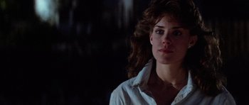 Movie still from “The Last Starfighter” (1984), directed by Nick Castle – A person wearing a white shirt; Close Up shot, Low angle