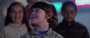 Movie still from “The Last Starfighter” (1984), directed by Nick Castle – A young boy is looking up at the sky; Close Up shot, Low angle