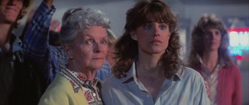 Movie still from “The Last Starfighter” (1984), directed by Nick Castle – A woman and an older woman standing next to each other; Close Up shot, Low angle