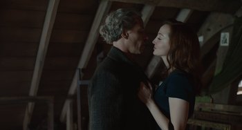 Movie still from “The Last Vermeer” (2019), directed by Dan Friedkin – A man and a woman standing next to each other; Close Up shot, Low angle