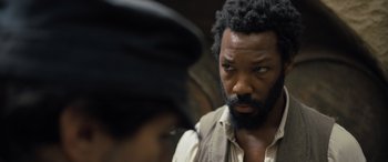 Movie still from “The Last Voyage of the Demeter” (2023), directed by André Øvredal – A man with a beard is looking at another man; Close Up shot, Over the shoulder angle