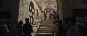 Movie still from “The Last Voyage of the Demeter” (2023), directed by André Øvredal – A group of people standing on some stairs; Wide shot, High angle